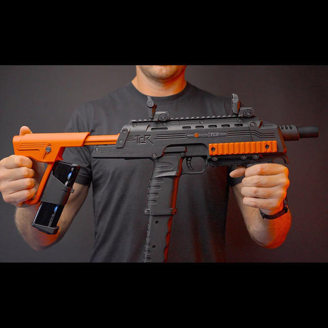 Person holding a Byrna TCR Basic Launcher
