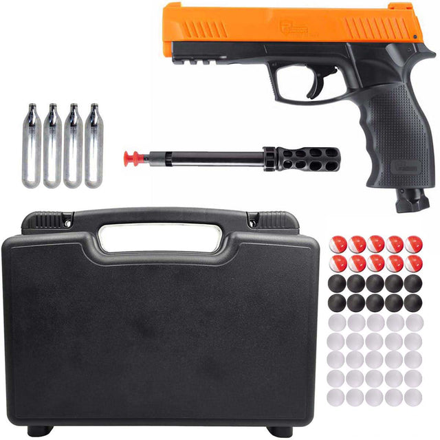 The image shows a .50 caliber Umarex HDP50 Gen 2 P2P Home Defense Pistol with orange accents, accompanied by 12-gram CO2 cartridges, a cleaning rod, a lockable case, and a assortment of round projectiles included pepper rounds.