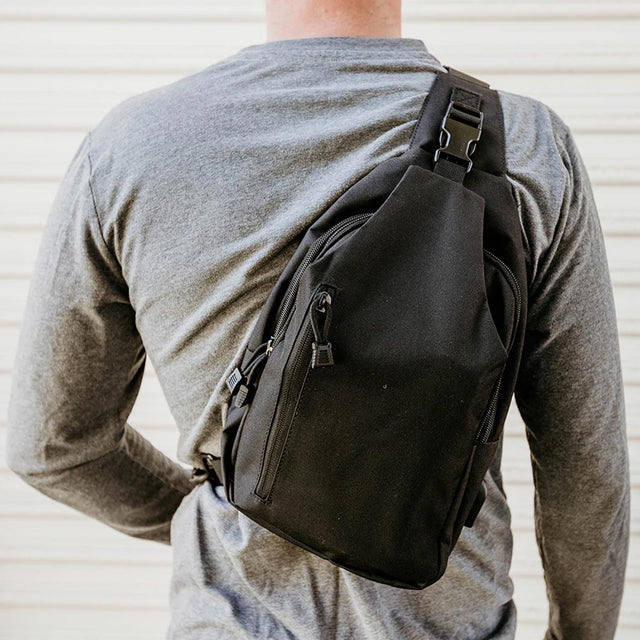 Byrna Concealed Carry Sling Bag Gen 2 Black on a persons back