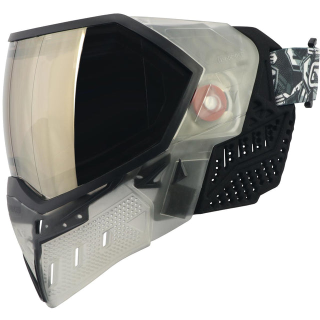 Left side of Black and clear white paintball mask with reflective lens Empire EVS Goggle Clear Black HD Black Chrome Lens on a white