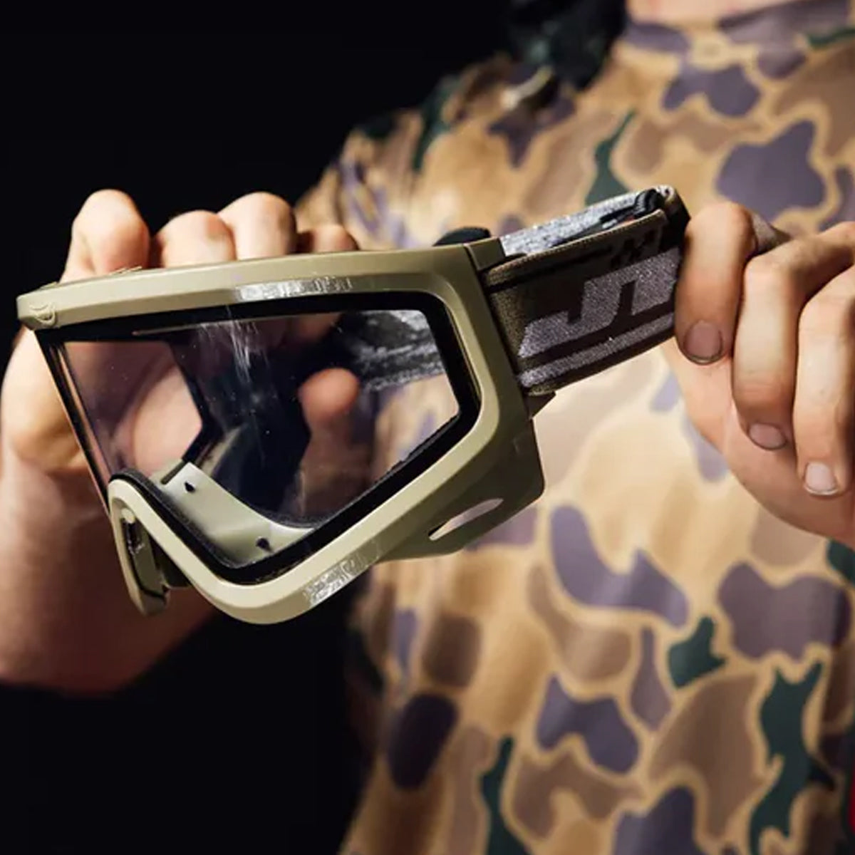 JT QLS Goggle Frame with Lens and Strap Olive in players hands