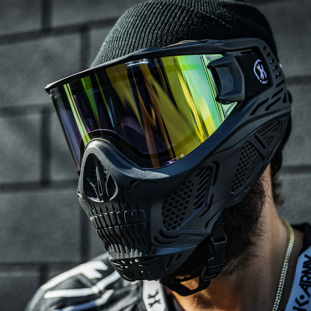 Person wearing a paintball goggle with HK Army HSTL Thermal Lens dual pane gold mirror