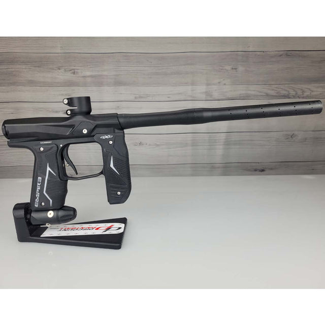 Right side USED Empire Axe 2.0 Paintball Marker Black on a woodgrain background