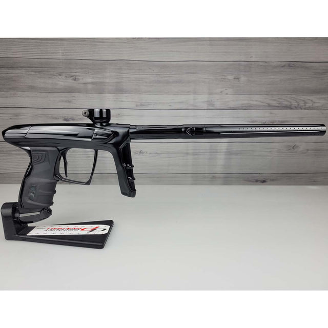 Right side USED DLX Luxe IDOL Paintball Marker Black Polished on a woodgrain background