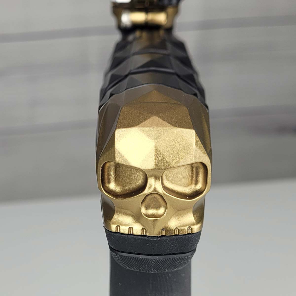 Gold Skull close up on USED Planet Eclipse Infamous CS3 paintball marker