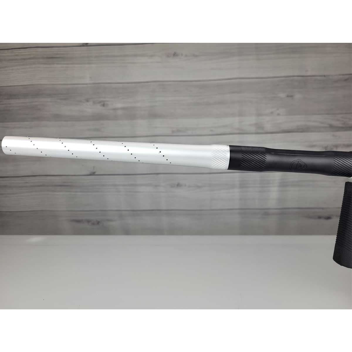 Left side barrel USED Shocker Era Silver black paintball marker in a stand on a woodgrain background.