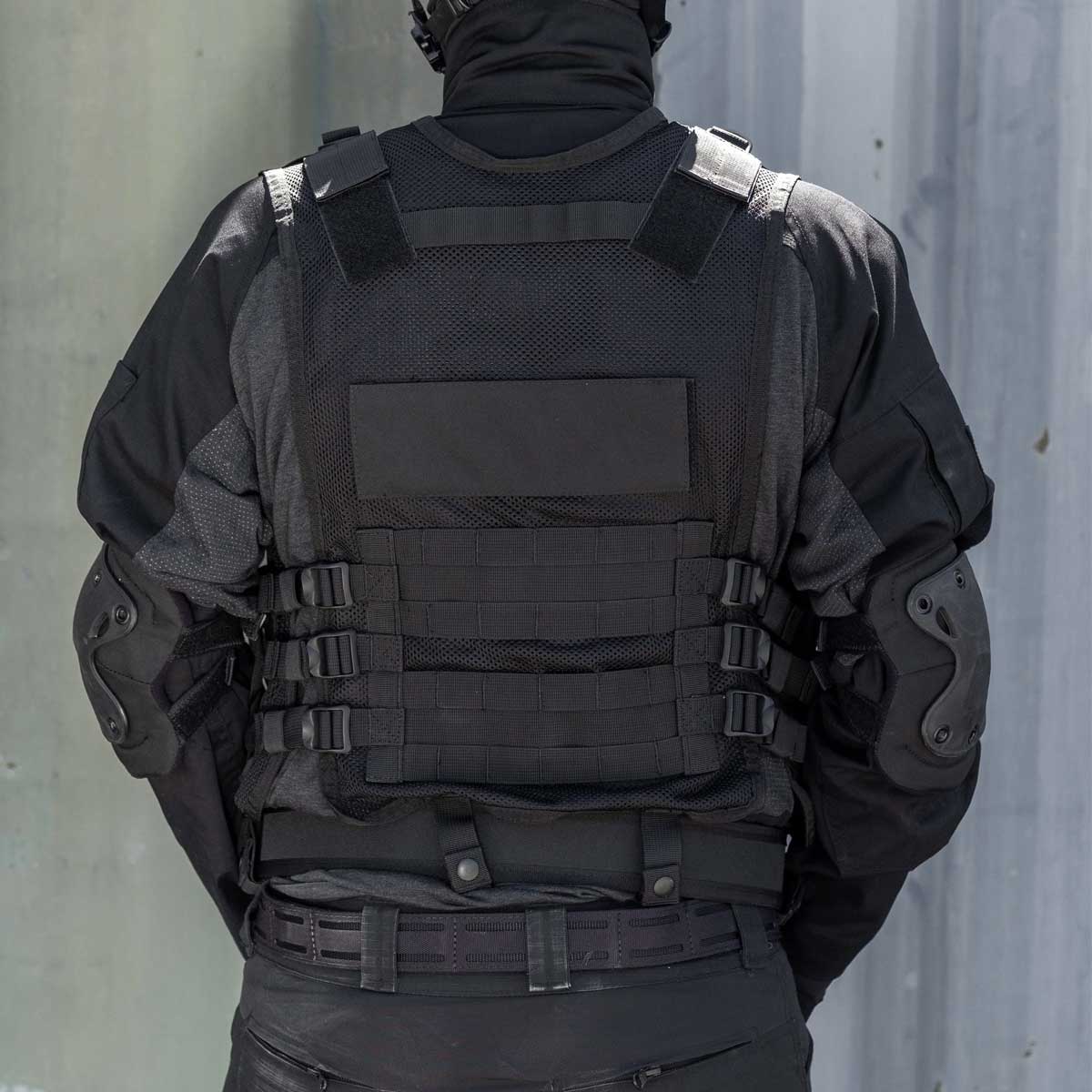 Back black BSX Crossdraw Vest for for airsoft and paintball, shown on a person.