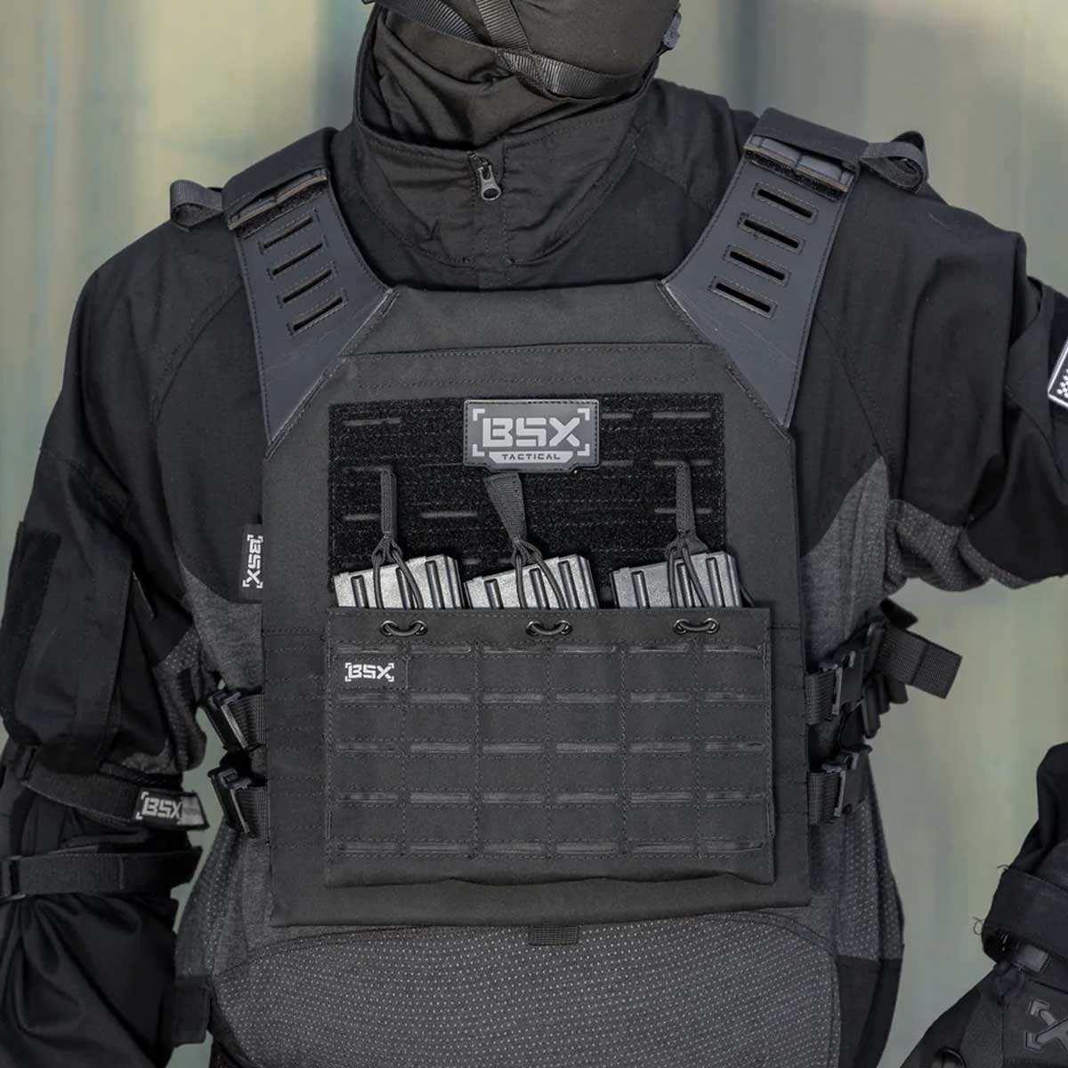 Front of black BSX Plate Carrier LC for airsoft and paintball with mags on a person dressed in tactical gear