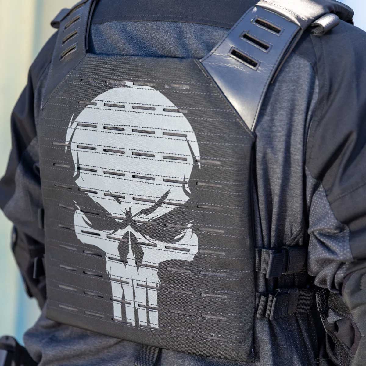 Person wearing a black HK Army BSX Skull Plate Carrier for molle attachments for airsoft and paintball, shown from the back