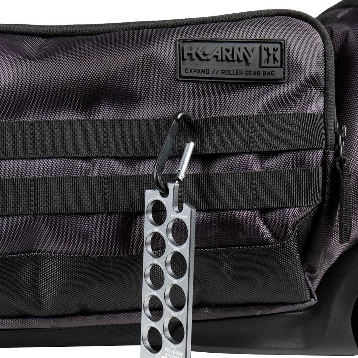 Close up of the molle straps on a black and grey camo HK Army Expand 75L Roller Gear Bag Shroud Blackout against a white background