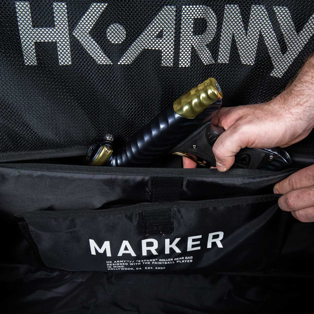 Open marker compartment Black green and grey camo print HK Army Paintball Expand 75L Roller Gear bag Shroud Forest on a white background