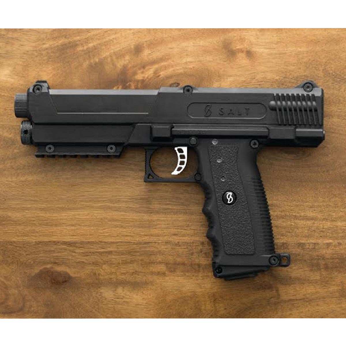 Salt .68 Caliber Self Defense launcher on a wood background