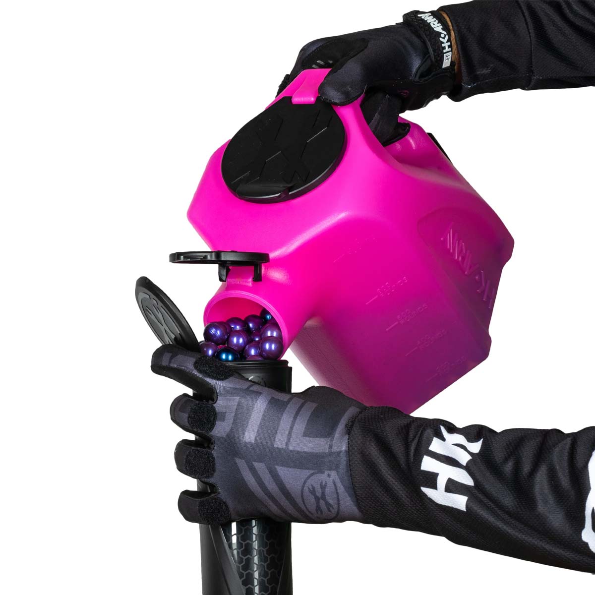 pink plastic HK Army Reload Paintball Hauler Caddy loading paintballs into a pod.