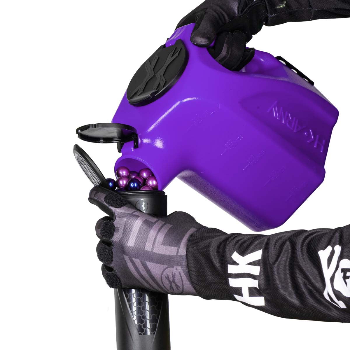 Purple plastic HK Army Reload Paintball Hauler Caddy loading paintballs into a pod.