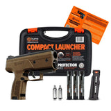 Byrna CL Compact Launcher Universal Kit Topo Bronze with a tan and black launcher, black carrying case, three CO2 cylinders, a black magazine, and an orange instruction manual on a white background.