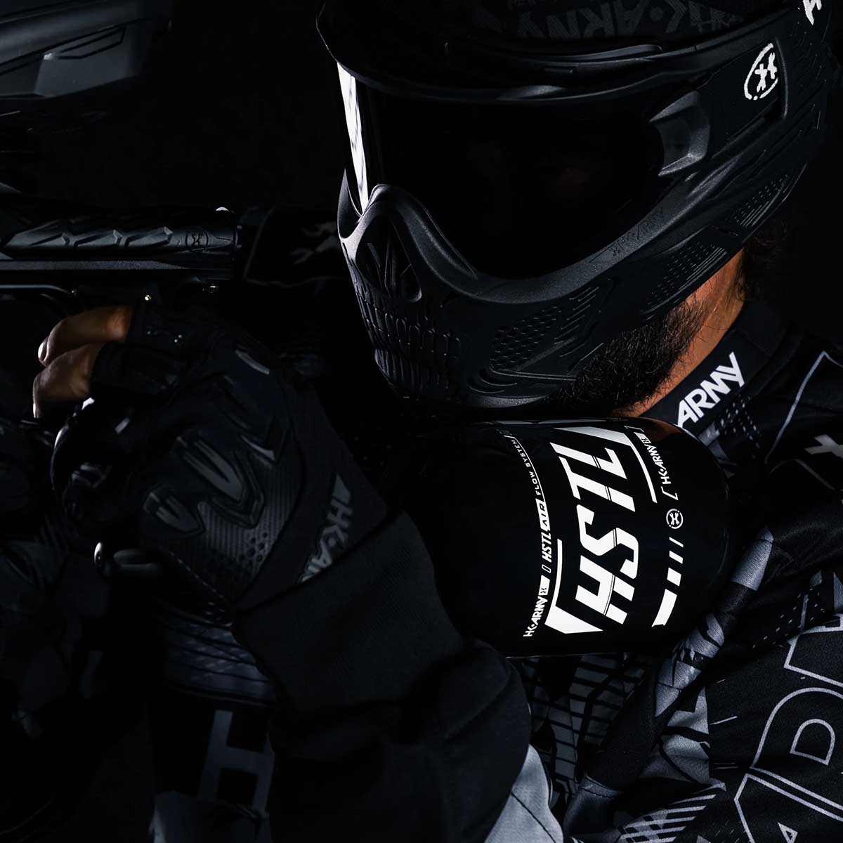 Player in HK Army gear using the HK Army HSTL 68ci 4500psi Carbon Fiber Air Tank in black