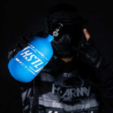 player holding the blue and white HK Army HSTL 68ci 4500psi Carbon Fiber Air Tank