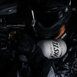 player in HK Army clothing using a grey and black HK Army HSTL 68ci 4500psi Carbon Fiber Air Tank