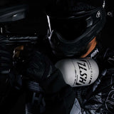 player in HK Army clothing using a grey and black HK Army HSTL 68ci 4500psi Carbon Fiber Air Tank
