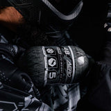 Paintball Player shouldering a HK Army Aerolite 48ci 4500psi Compressed Air Tank Clear