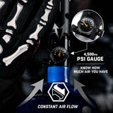 A close-up of a HK Army regulator with a black and silver PSI gauge, shown with a blue bottle. The image includes a circular inset showing the gauge detail, text reading '4,500PSI PSI GAUGE' and 'KNOW HOW MUCH AIR YOU HAVE', and arrows indicating 'CONSTANT AIR FLOW'.
