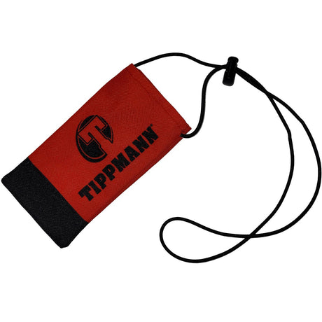 Red and black Tippmann barrel blocker with black strap and 'Tippmann' branding on a white background