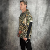 JT Paintball Grind Playing Hoodie Branch Camo on model on a grey background