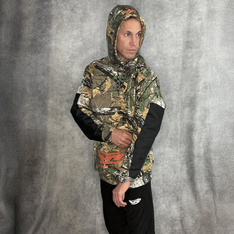 JT Paintball Grind Playing Hoodie Branch Camo on model on a grey background