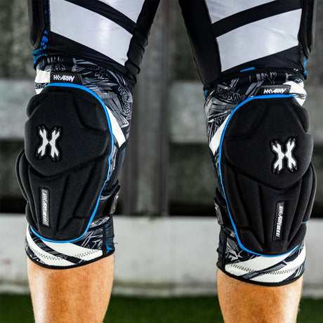 close up front view Pair of black and blue HK Army Crash Knee Pads on a player