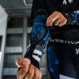 inside of Black blue and white HK Army Crash Elbow Pads for paintball and other sports  on a person