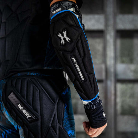 Black blue and white HK Army Crash Elbow Pads for paintball and other sports on a person from the back