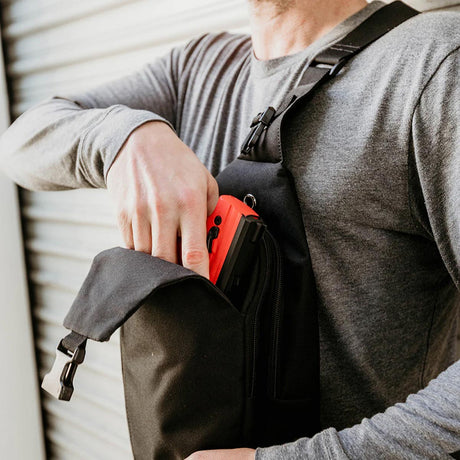 Byrna Concealed Carry Sling Bag Gen 2 Black worn by a person