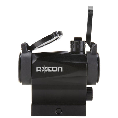 Left side view black AXEON 7XRGB20 Optic Tri Color Dot Sight for rifle mounting on a Picatinny rail with sight covers lifted.