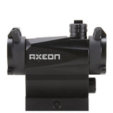 Left side view black AXEON 7XRGB20 Optic Tri Color Dot Sight for rifle mounting on a Picatinny rail.