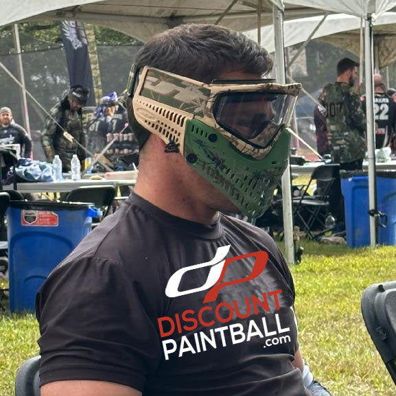 paintball player wearing the JT Proflex LE Goggle Palm Tree with Clear lens green and tan goggle