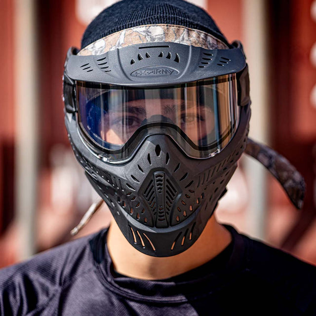 Front side Black HK Army HSTL Thermal Paintball Goggle mask with a clear lens  shown on a person