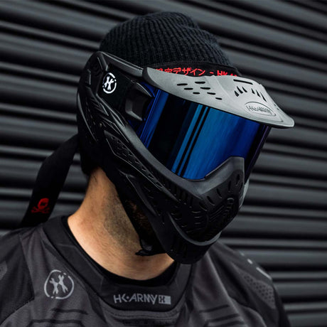 Black HK Army HSTL Thermal Paintball Goggle mask with a blue lens and white AH logo on the side, shown on a person