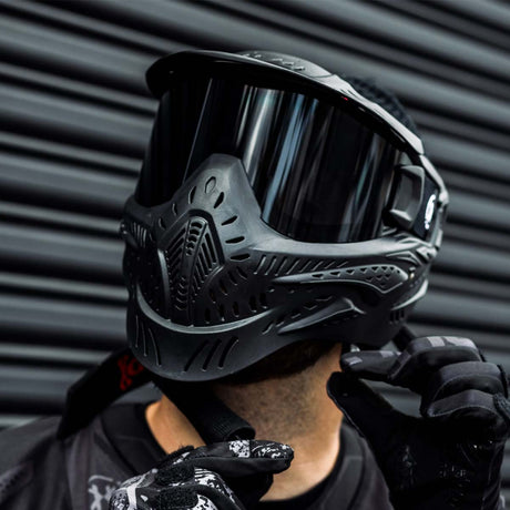 Black HK Army HSTL Thermal Paintball Goggle mask with a smoke lens and white AH logo on the side, shown on a person.