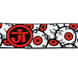 Close up Jt paintball goggle strap in orange red, black and white with eyeballs for Proflex and Flex 8 on a white background.
