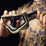 JT QLS Goggle Frame with Lens and Strap Olive in players hands