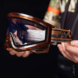 JT QLS Goggle Frame with Lens and Strap Brown Ice in players hands