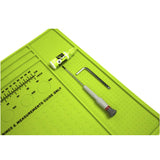 Close up of Eclipse Magnetic Tech Mat XL Green for paintball repairs with ruler, oring sizes, anti roll for barrels, roll up rubber shown with tools and oil on a white background.