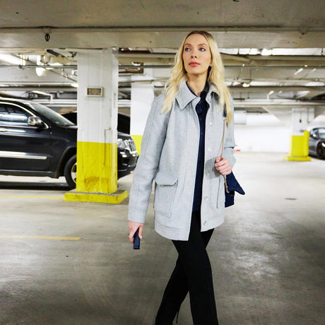 woman carrying Sabre 2-In-1 Pepper Spray With Personal Alarm