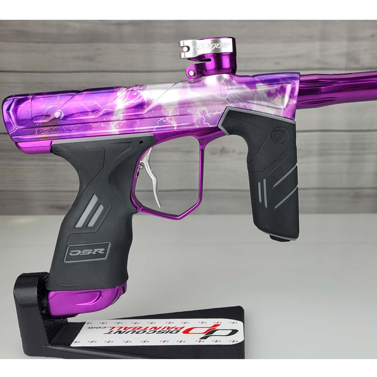Right side body USED DYE DSR Pro PGA Grimace Purple Splash against a wood panel background.