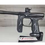 Left side body USED Empire Axe 2.0 Paintball Marker Black on a woodgrain background