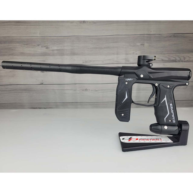 Left side USED Empire Axe 2.0 Paintball Marker Black on a woodgrain background