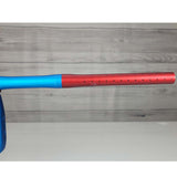 Right side barrel USED Empire Axe Pro Red Blue Silver paintball marker on a panel background.