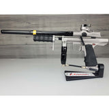 USED Empire Sniper Pump Grey paintball marker with a black and silver design on a white surface with a wooden background