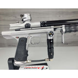 Right side body USED Empire Sniper Pump Grey paintball marker with a black and silver design on a white surface with a wooden background