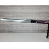Left side barrel USED DLX Luxe X Silver Black on a panel background.